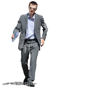businessman with notes in his hands walking hastily