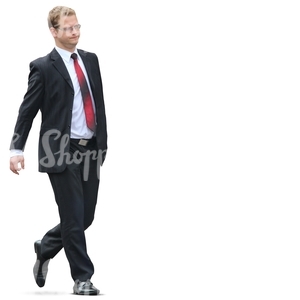 young businessman in a black suit walking