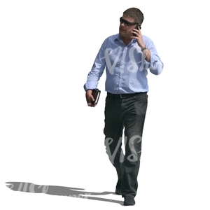 businessman walking and talking on the phone