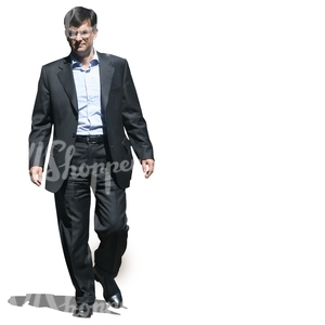 businessman in a black suit walking