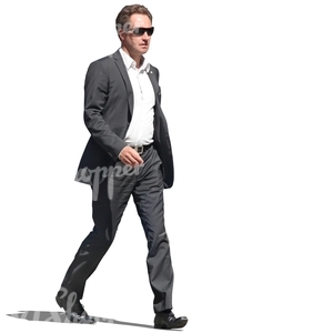 businessman with sunglasses walking