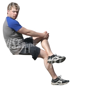 young man sitting and listening to music