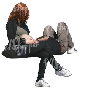 woman sitting and a man sleeping on the bench