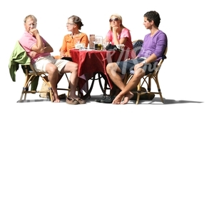 four people sitting in a street cafe