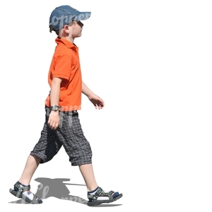 young boy with a baseball cap walking