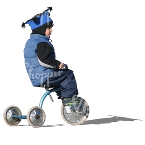 cut out boy riding a three-wheeled bike
