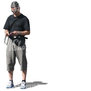 cut out man standing and reading a map