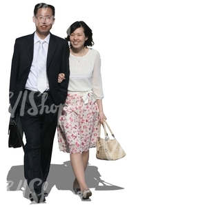 asian couple in formal clothes walking arm in arm