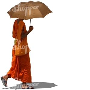cut out buddhist monk walking with an umbrella