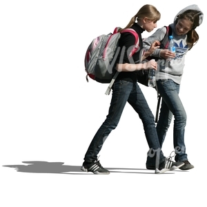 two teenage girls with backpacks walking together