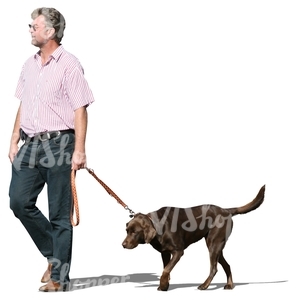 middle-aged man walking a dog