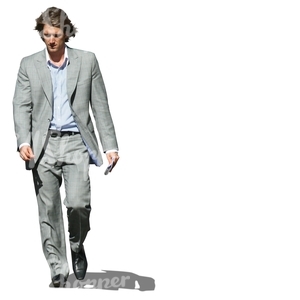man in a grey suit walking