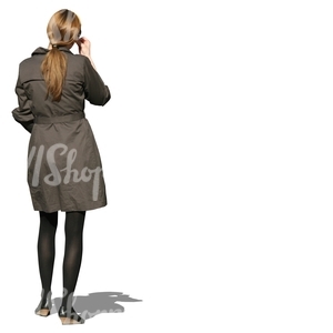 woman in a trenchcoat standing