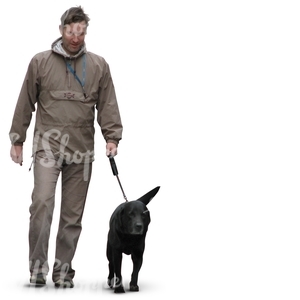 man walking a black dog