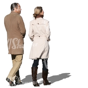 man and woman walking in autumn
