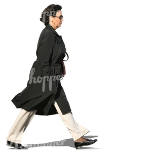 woman in a black autumn coat walking