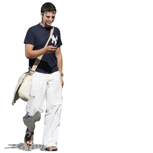 man walking and looking at his phone