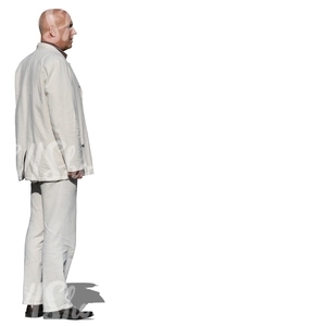 man in a white suit standing