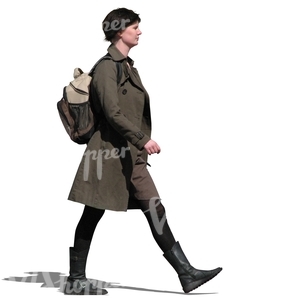 woman in a brown spring coat walking