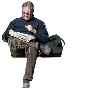 man sitting and reading a newspaper