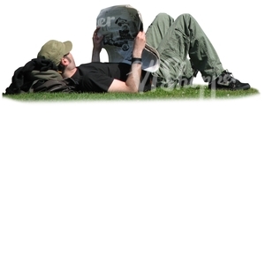 man lying on the grass and reading
