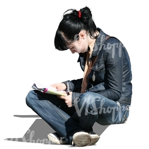 young woman sitting and reading a newspaper