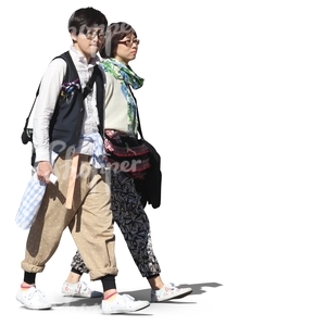 two bohemian asian people walking together