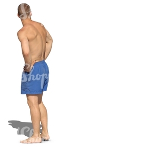 man in swim shoerts standing