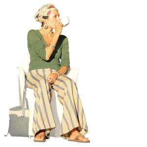 woman sitting in a chair and drinking coffee
