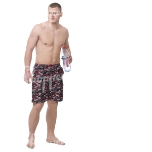 shirtless man standing barefoot