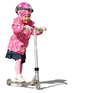 girl with a pink helmet riding a scooter