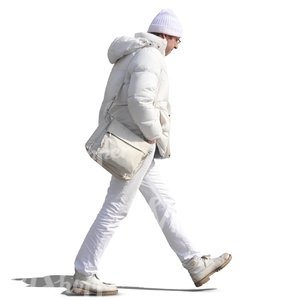man in white winter clothes walking