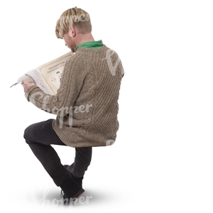 man sitting and reading a newspaper