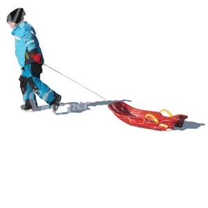 young boy pulling a sledge