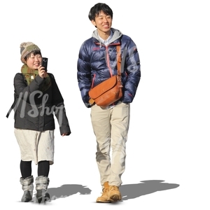 asian couple walking and taking pictures
