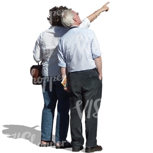 older couple standing and pointing