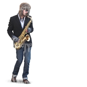 man playing saxophone on the street during winter time