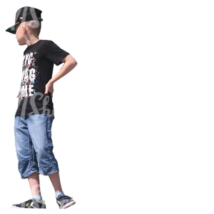 boy with a cap standing seen from below