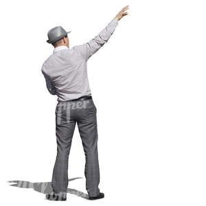 man with a grey hat standing and pointing at smth