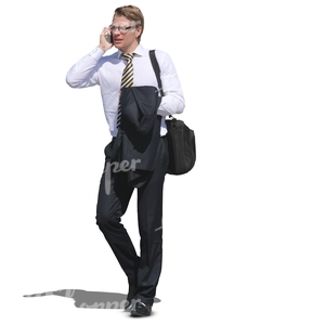 young businessman walking anf talking on his cellphone