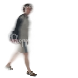 motion blur image of a man with a bag walking