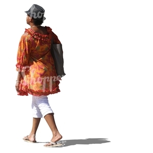 black woman with a hat and in a colorful blouse walking