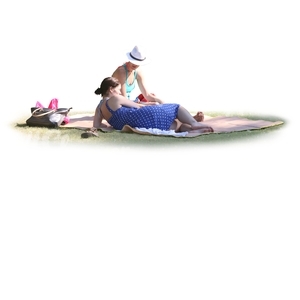 two women lying on the grass