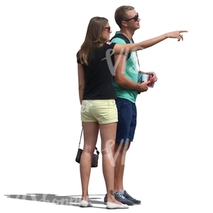 couple standing and pointing at smth