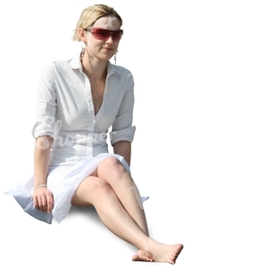 smiling young woman in a white dress sitting