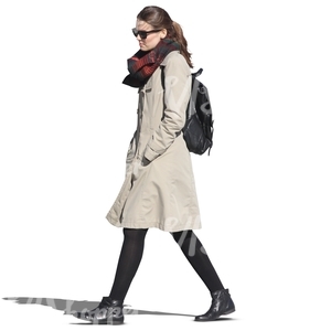 dark-haired woman in a grey spring coat walking