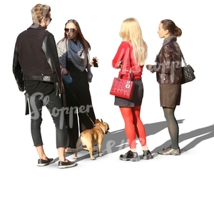 group of people and a dog standing in a circle
