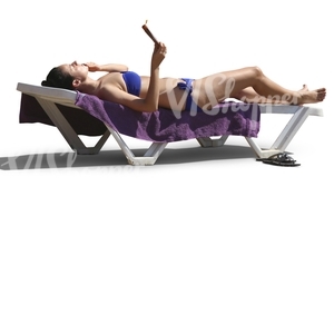 woman sunbathing on a beach chair