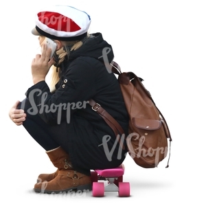 schoolgirl sitting on a skateboard
