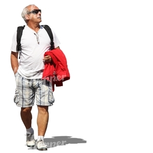 elderly man walking and looking up